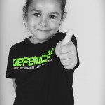 young girl thumbs up for kidz martial arts