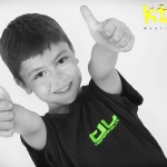 young boy two thumbs up for kidz martial arts