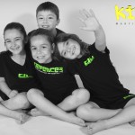 group of young children sat down and happy at kidz martial arts