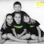 young children sat down in group hug kidz martial arts