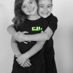 young girls hugging and smiling