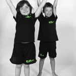 young girl and boy arms up celebrating