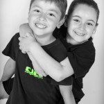 young girl hugging young boy