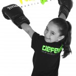young girl with training gloves and kidz logo